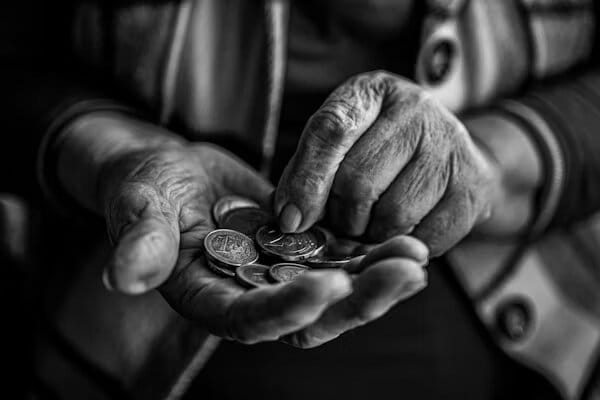 Hands transferring coins