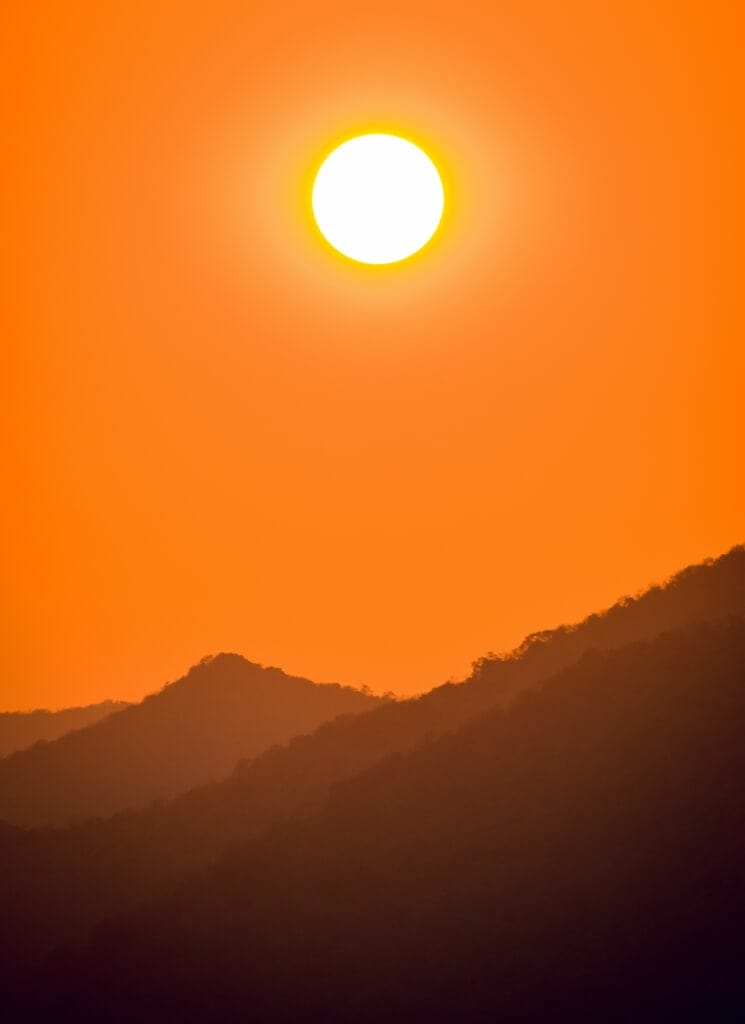 Hot sun over hills